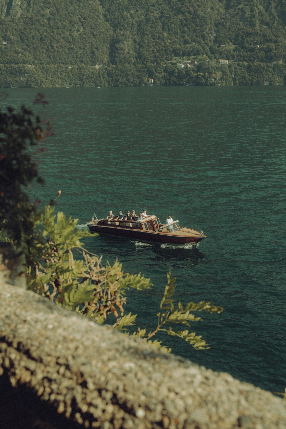 a group of people on a boat in the water