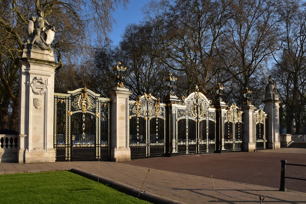 a large gate with a clock on top of it