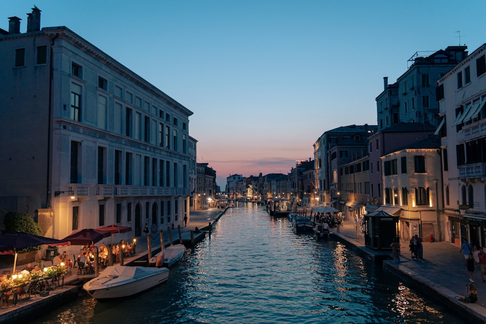 a canal that has a bunch of boats in it