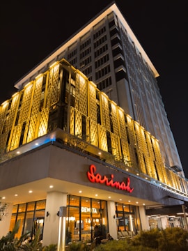 A vibrant commercial property storefront with elegant signage and warm lighting.