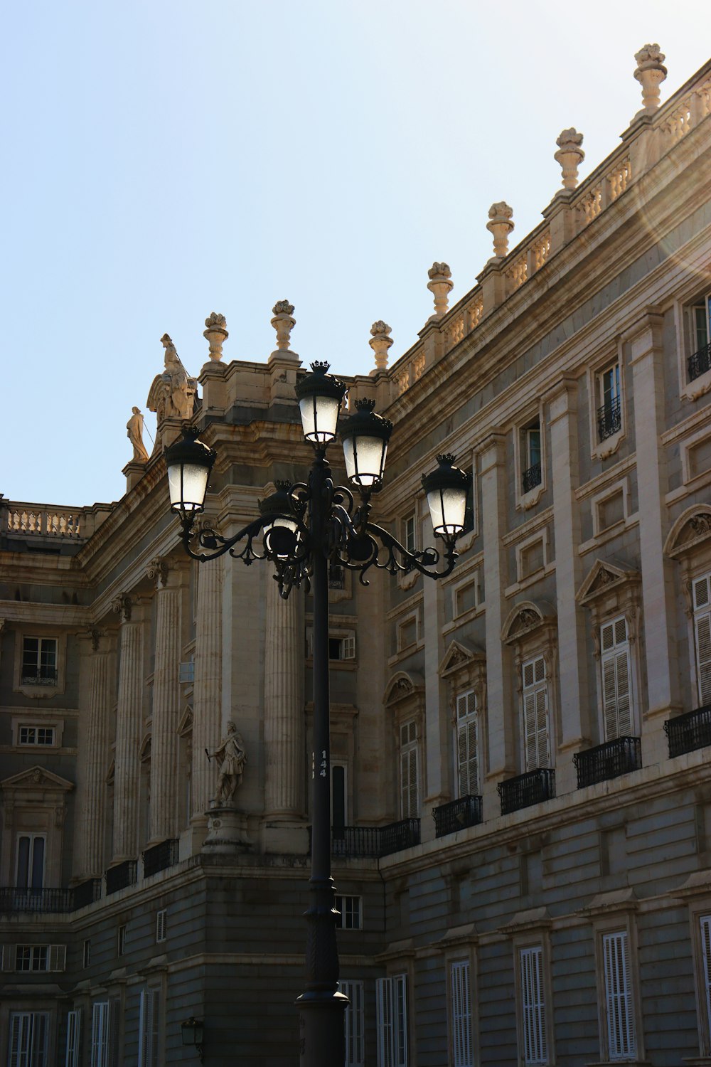 a lamp post in front of a large building