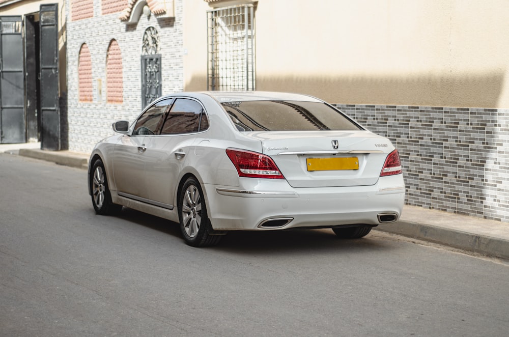 a white car parked on the side of the road