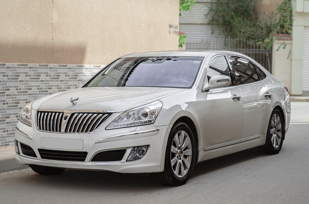 a white car parked on the side of the road