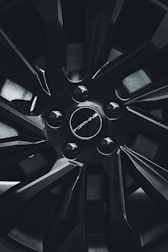 Side view of an Audi wheel featuring a sleek black centre cap.