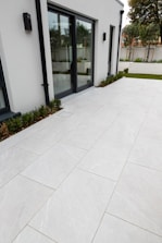 A modern home extension featuring large glass doors opening to a garden.