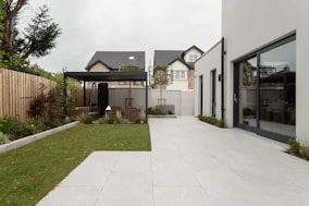 a house with a large yard and a covered patio