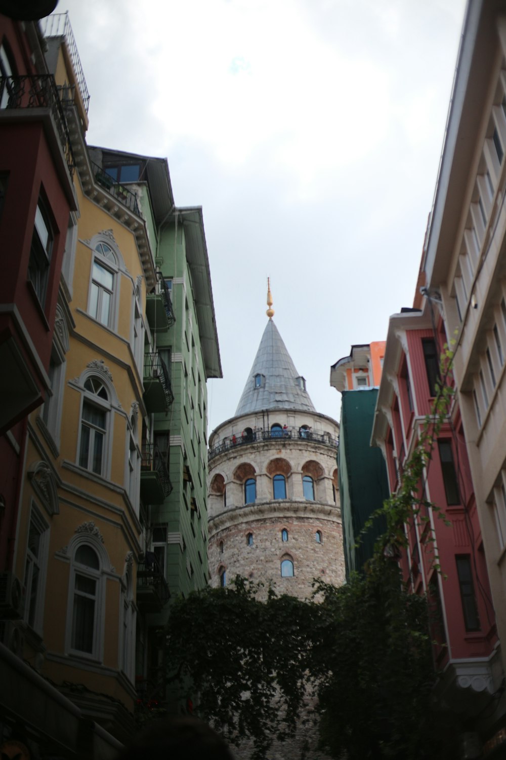 a view of a building from a narrow alleyway