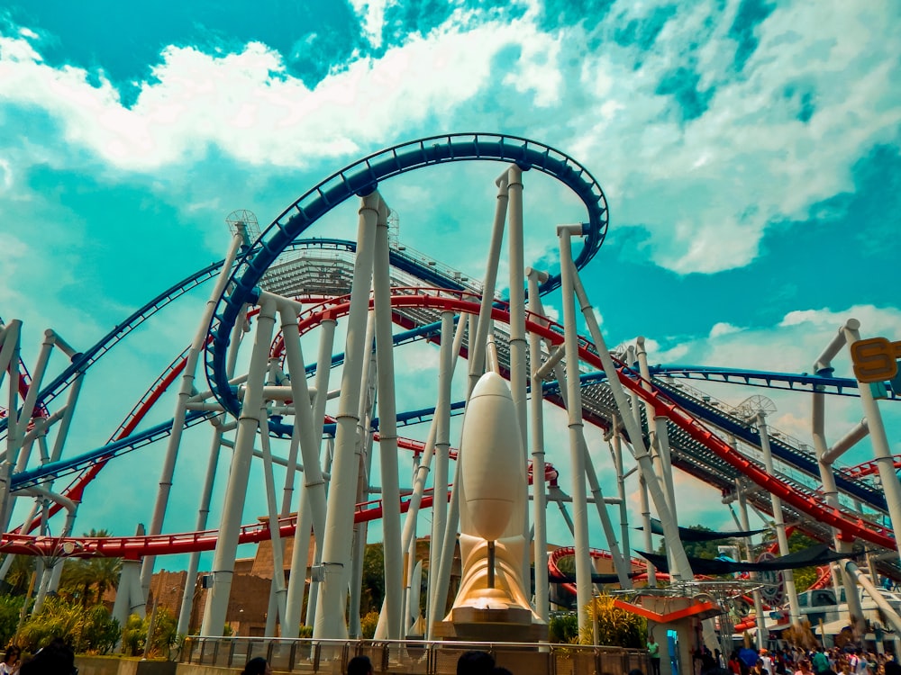 a roller coaster at a theme park during the day