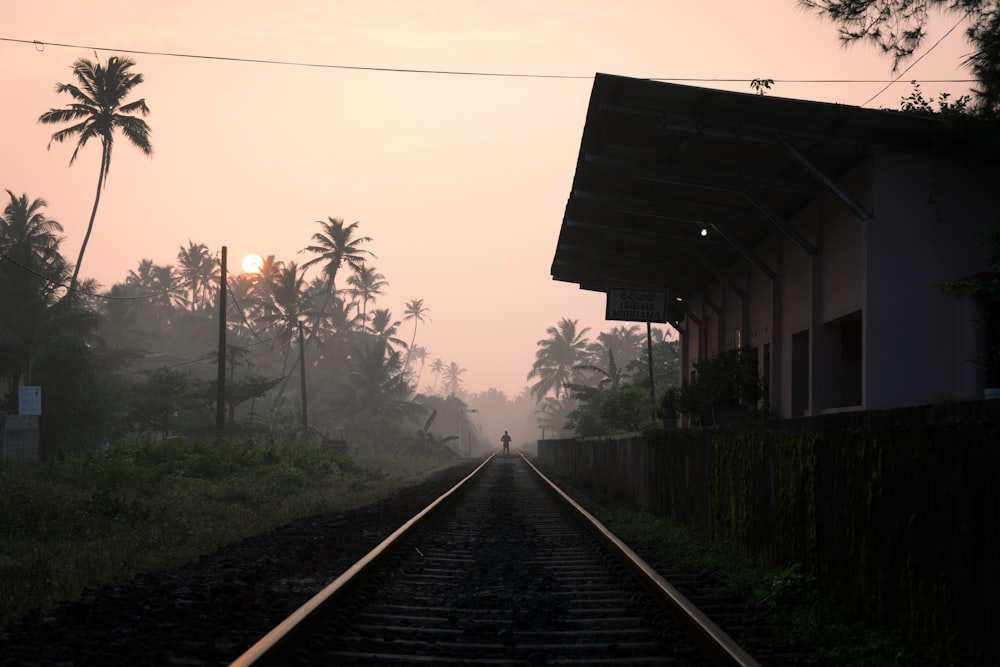 a train track with a person standing on it