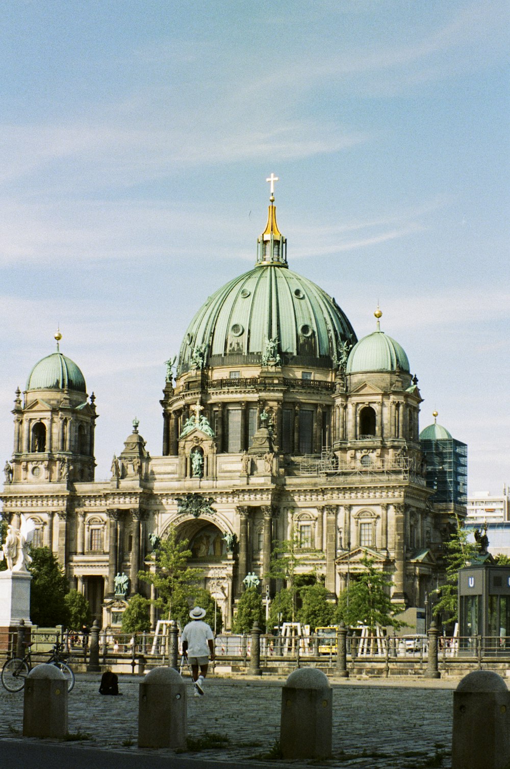 a large building with a green dome on top of it