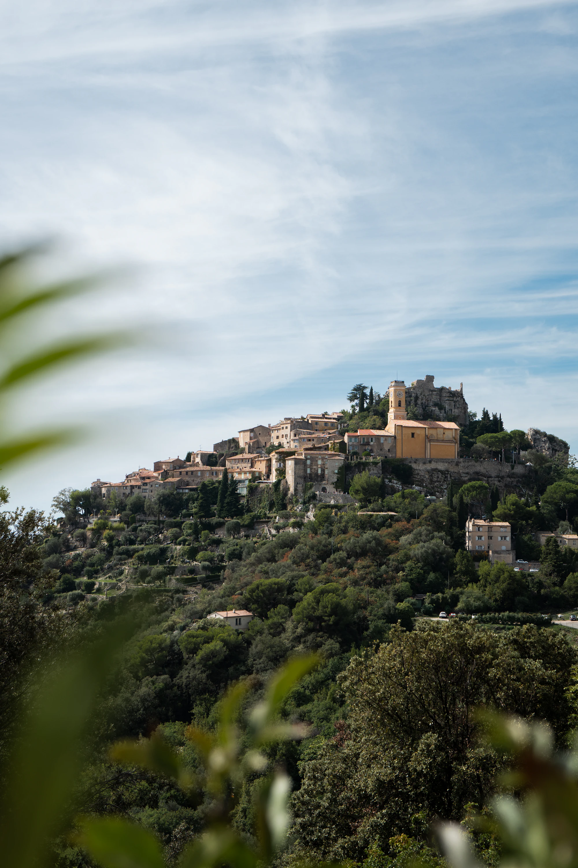 The medieval hilltop village of Èze surrounded by green slopes
