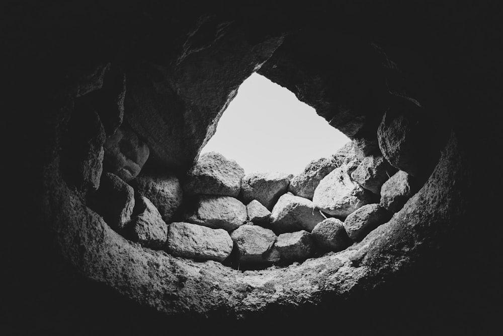 a black and white photo of rocks in a cave