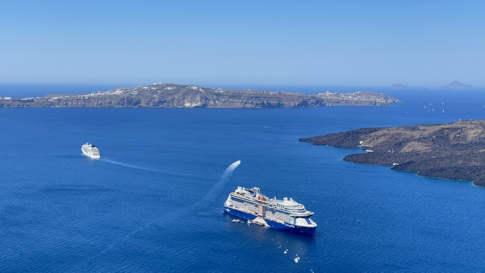 a cruise ship sailing in the middle of a large body of water