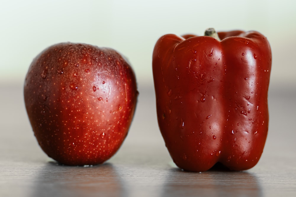 a red pepper and a red pepper on a table
