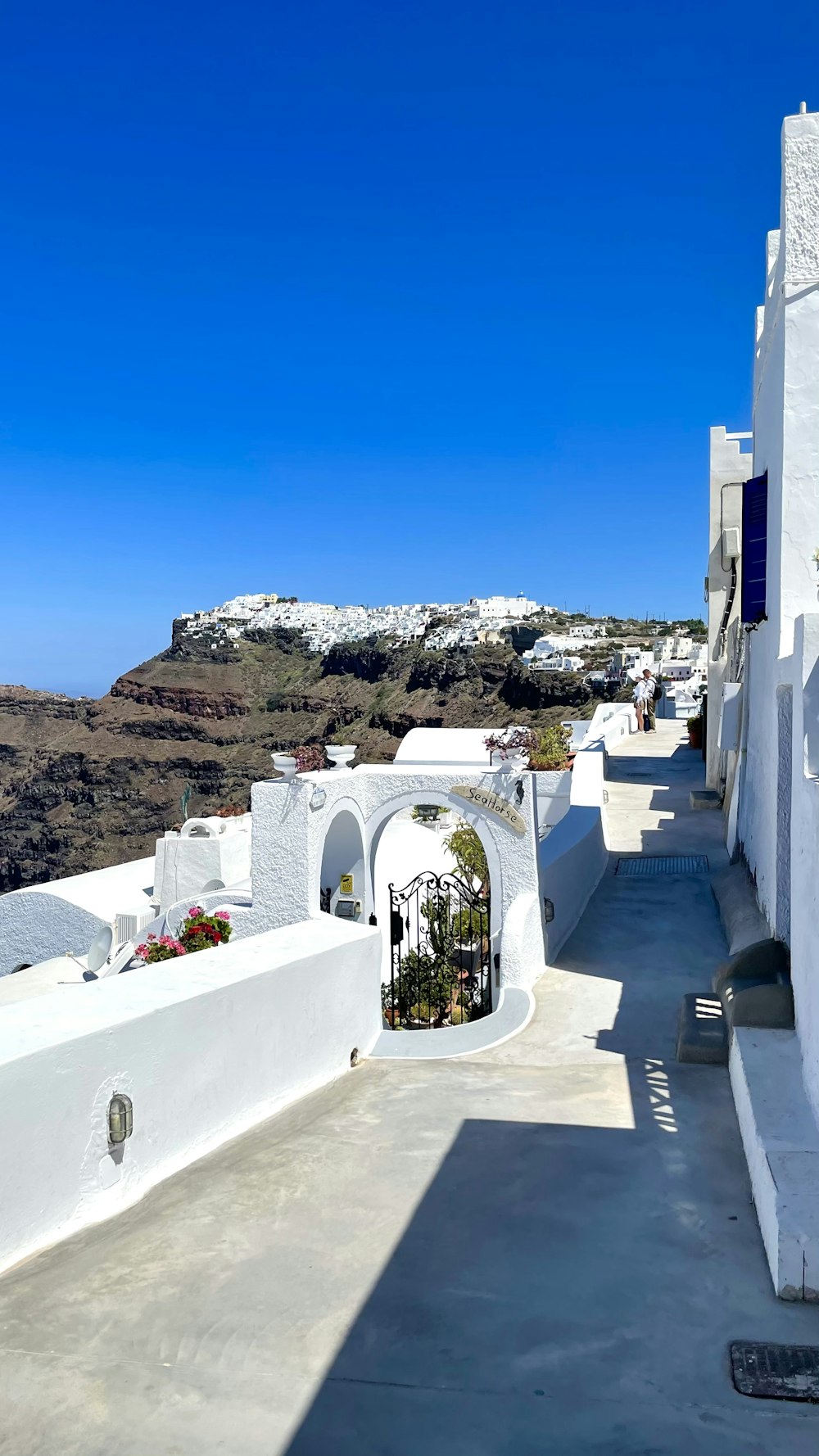 a white building with a blue sky in the background