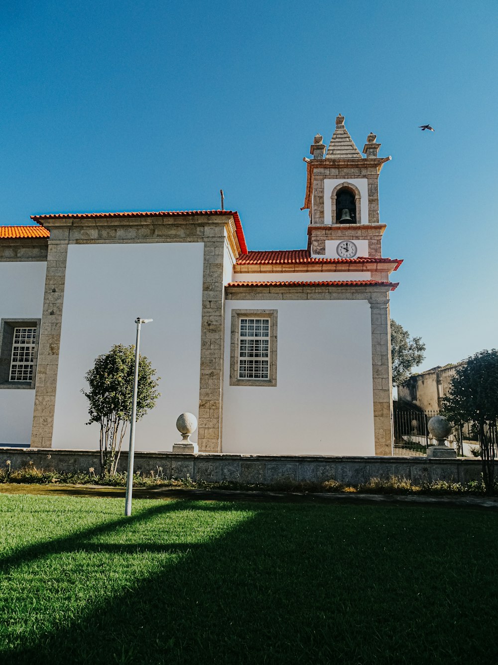 a large white building with a clock tower