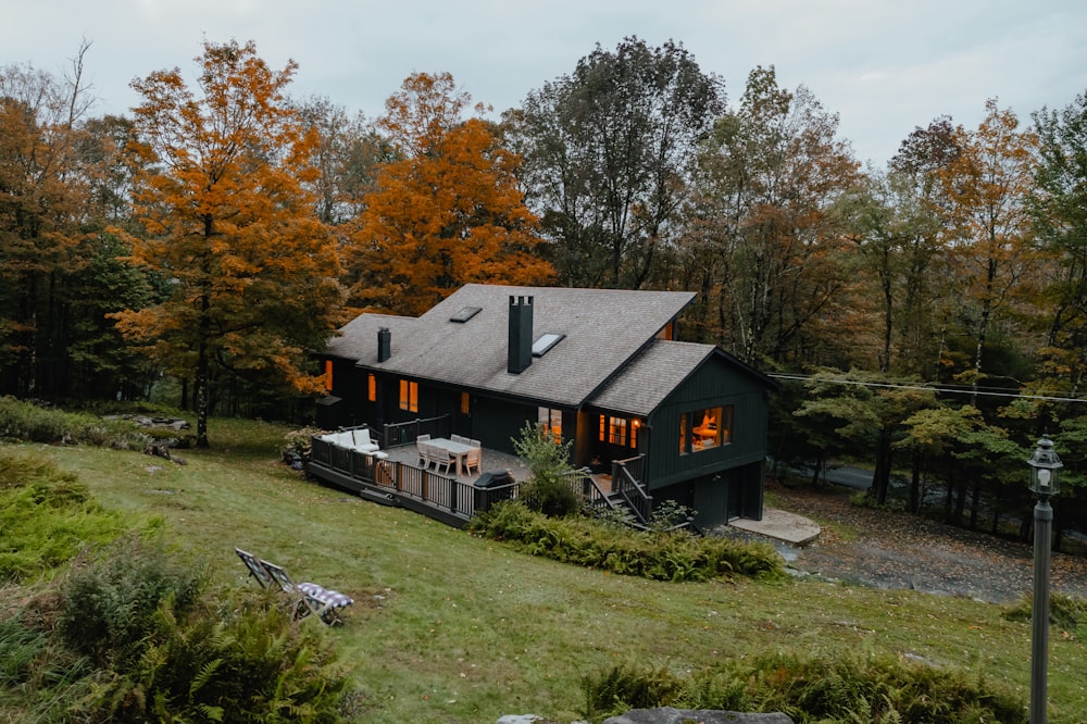 a house in the woods with a hot tub