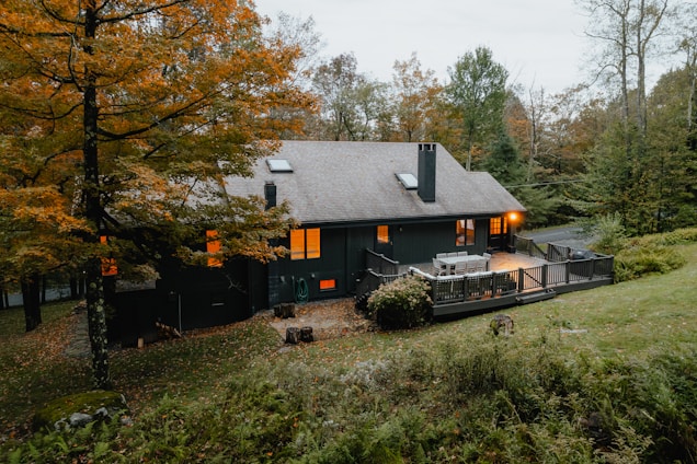A warm, inviting custom home nestled among tall trees in upstate South Carolina.