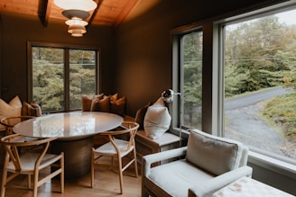 a dining room with a table and chairs