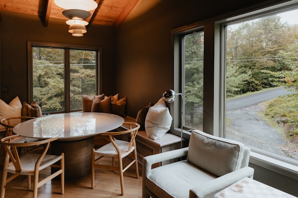 a dining room with a table and chairs