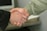 a close up of two people shaking hands