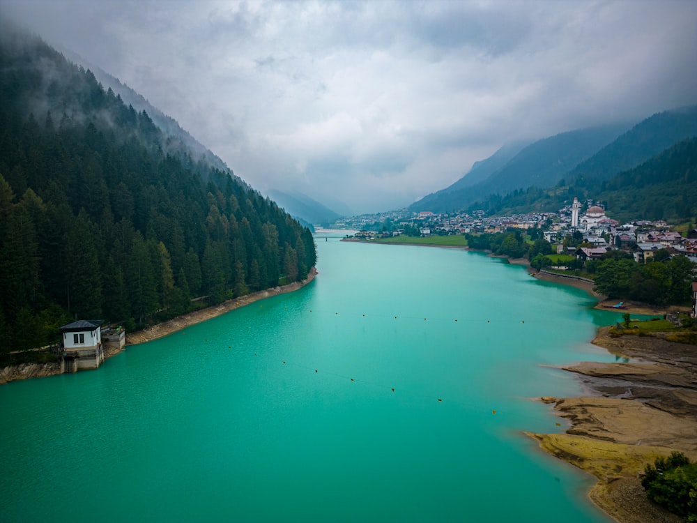 a body of water surrounded by mountains and trees