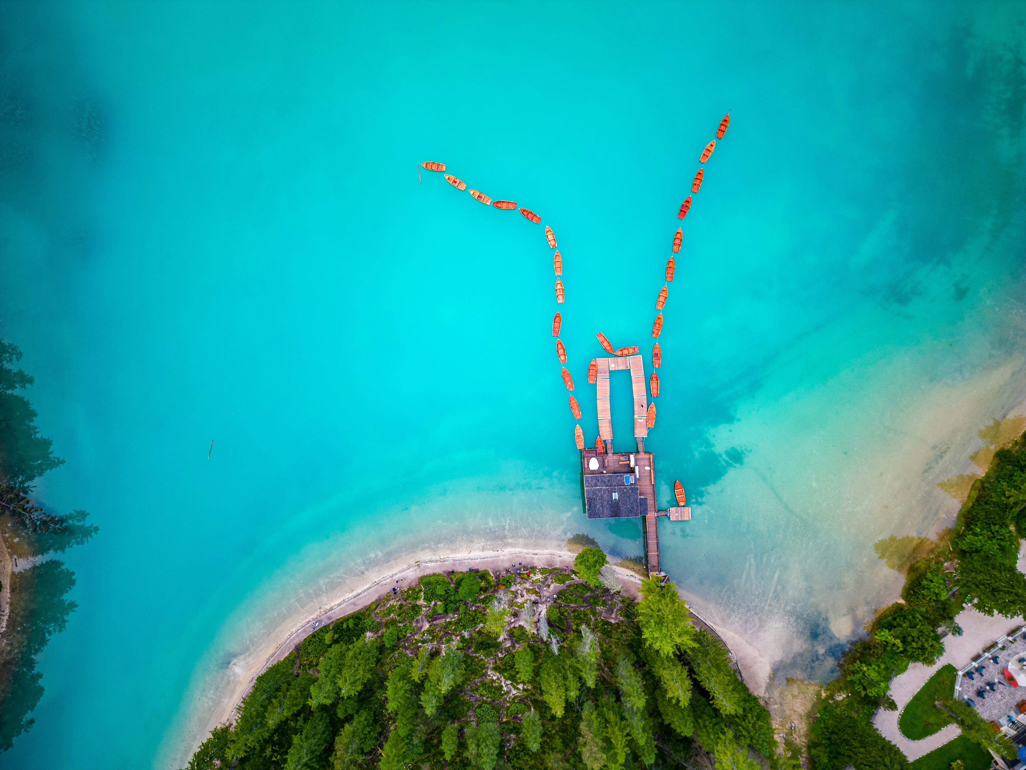 an aerial view of a dock in the water