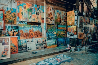 a bunch of paintings that are on a wall