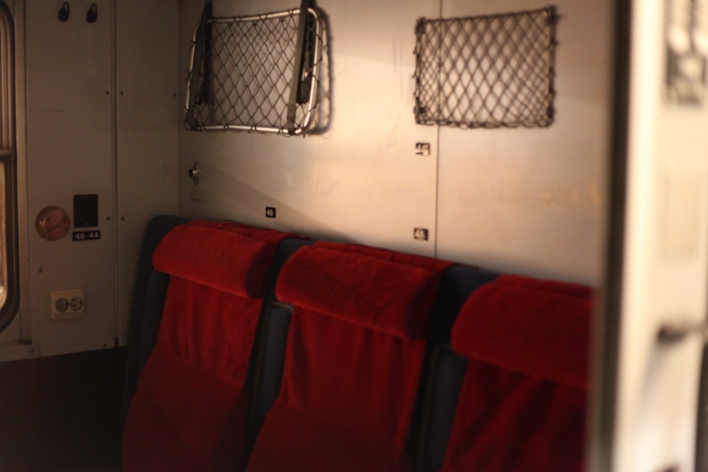 a row of red seats sitting next to each other