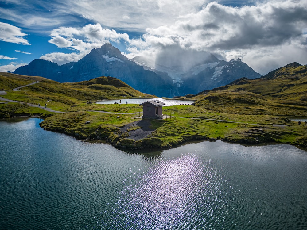 a small house on an island in the middle of a lake