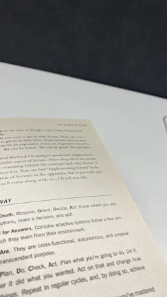 Close-up of the book’s 42 practical tools shown on a table surrounded by business documents.