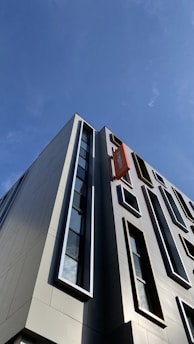 A modern real estate office with blue, orange, and white colors.