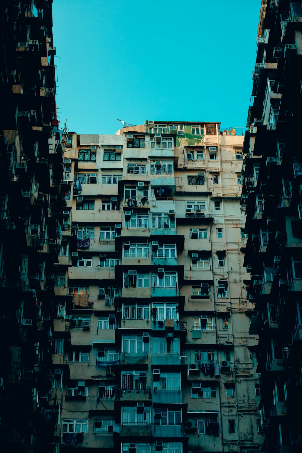 a tall building with lots of windows and balconies