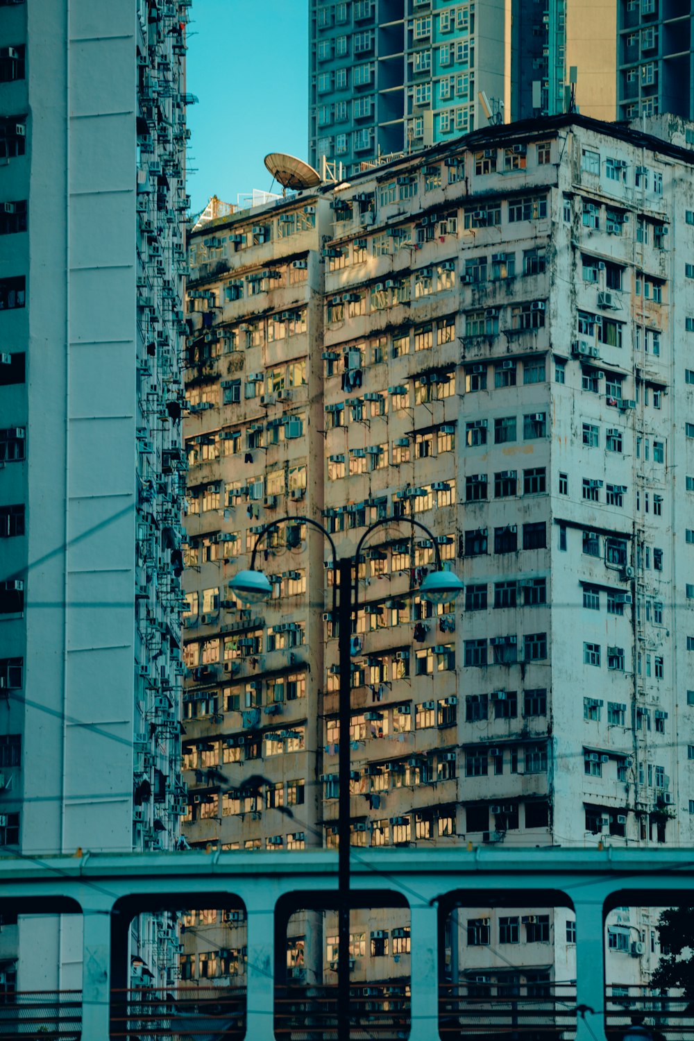 a bus driving past tall buildings in a city