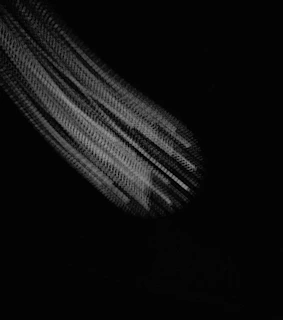 Grayscale abstract texture resembling microscopic fibers entangled in data streams.