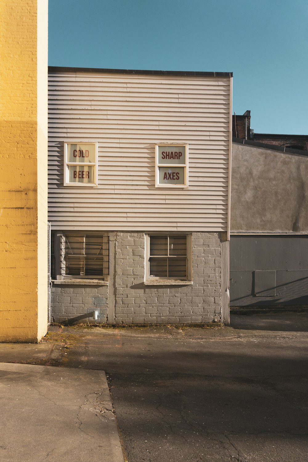 a building with three windows on the side of it