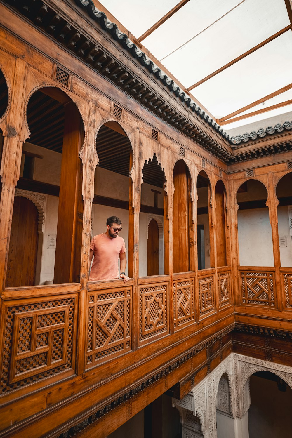 a man standing on a balcony of a building