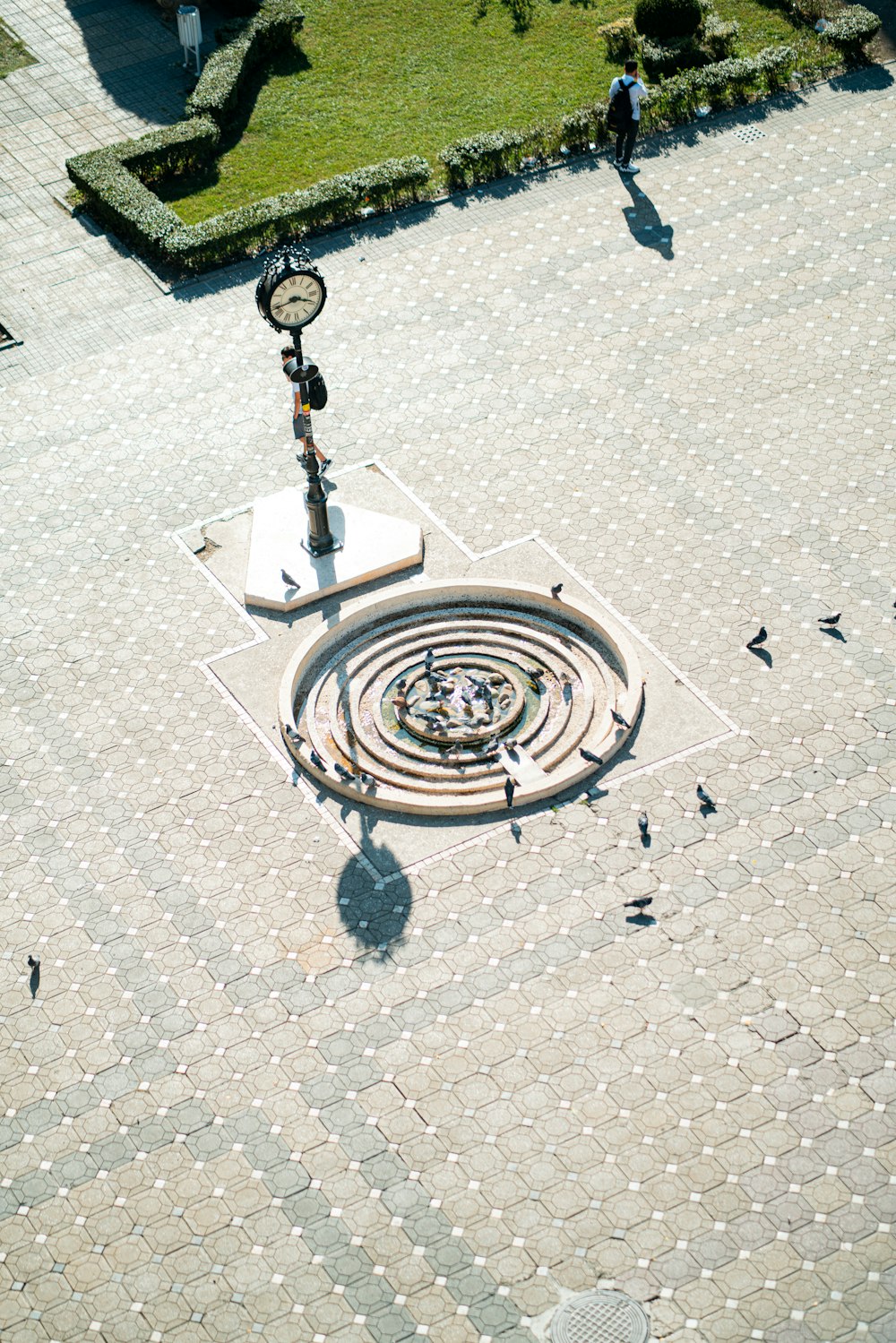 an aerial view of a fountain in a park