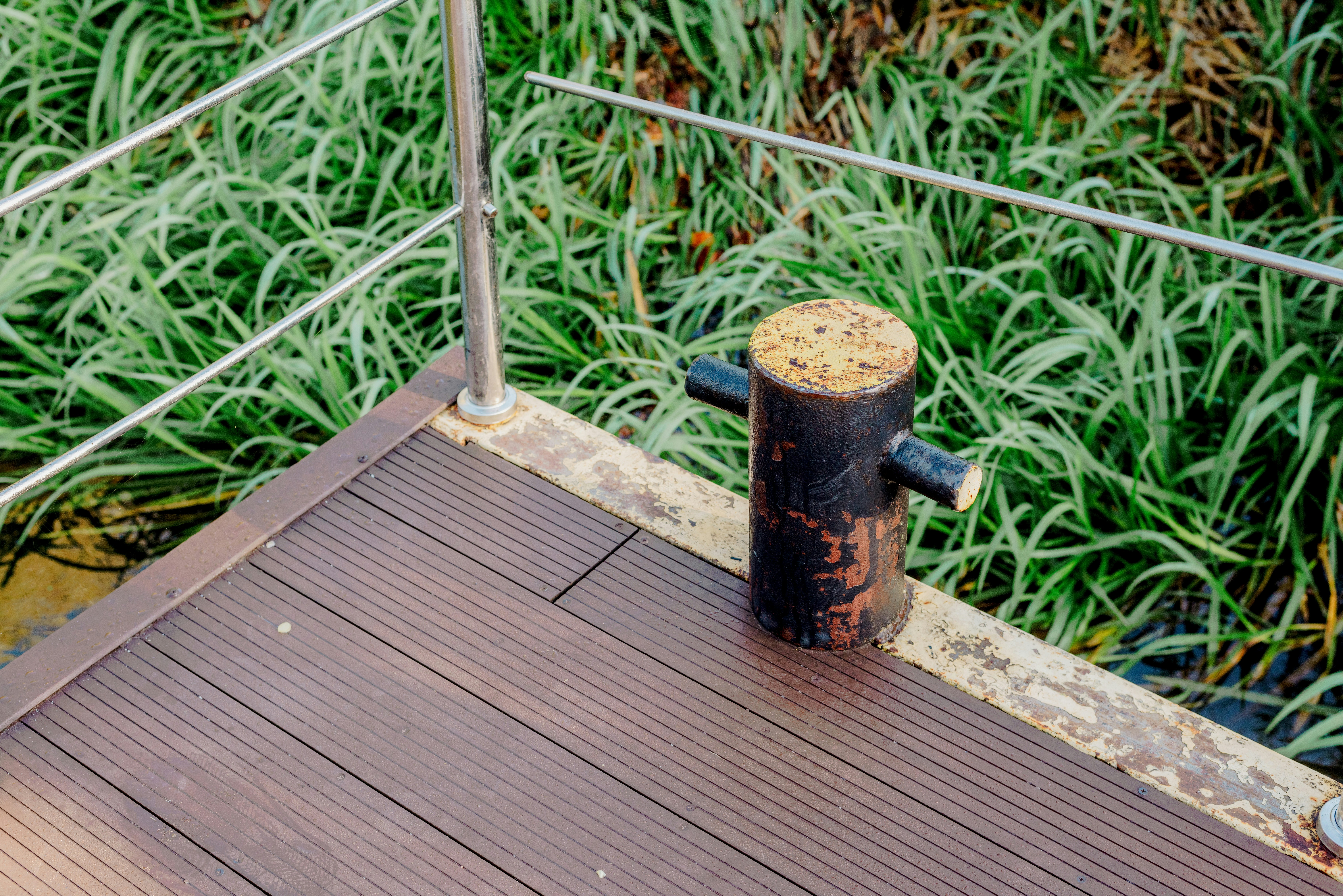 a fire hydrant sitting on top of a wooden deck