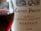 Close-up of a wine bottle label showing the name Calvet Prestige, Merlot, Cabernet Sauvignon, Bordeaux, and the year 2020. A glass of red wine is partially visible to the left.