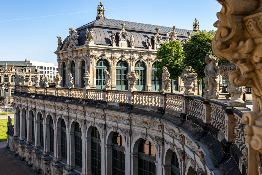 a large building with a balcony and a clock tower