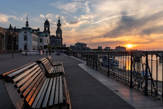 View of Barranquilla's Malecon del Rio at sunset with people enjoying the riverside promenade.