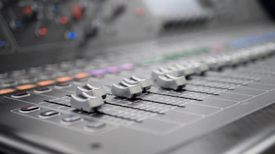 a close up of a sound mixing console