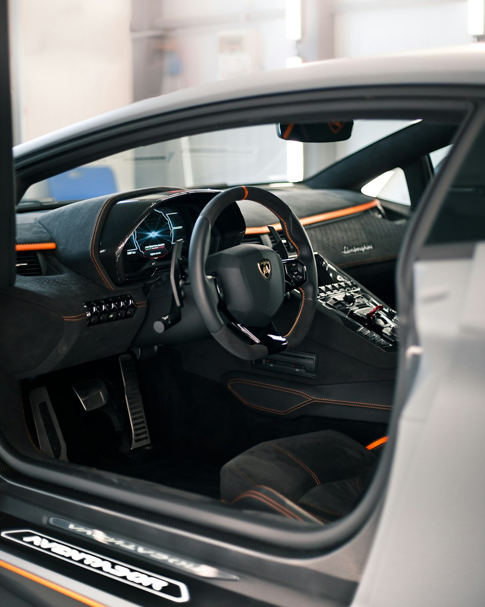 the interior of a car with a steering wheel and dashboard