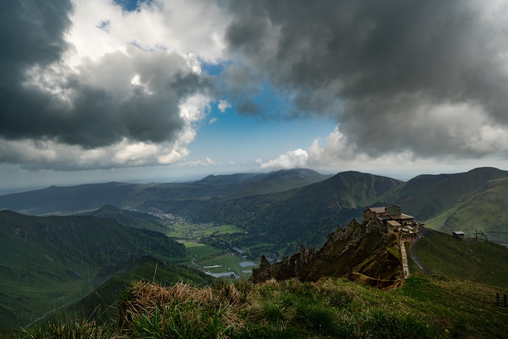 a view of a mountain range with a cloudy sky