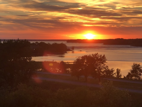 An inspiring landscape with a sunset over a quiet lake.