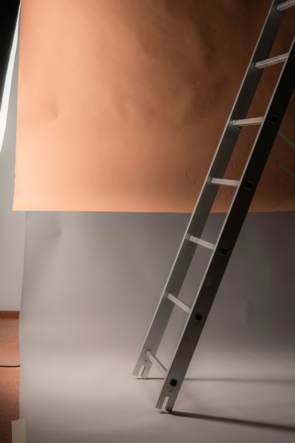 a ladder leaning against a wall in a room