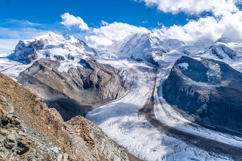 a view of a mountain range with snow on the mountains