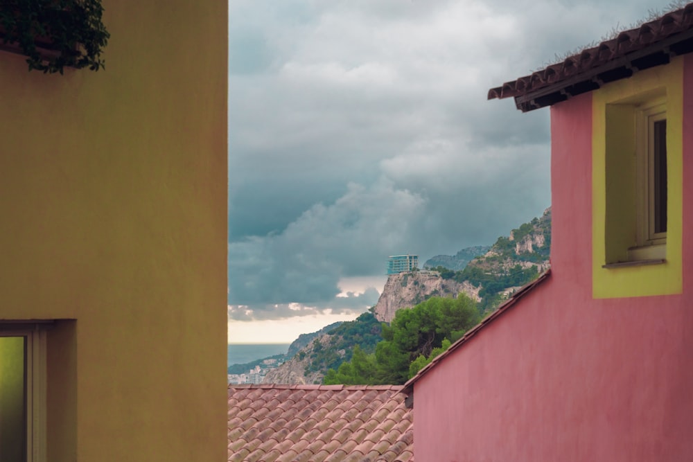 a view of a mountain from a window of a building