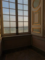 Interior shot showing elegant wood trim around windows glowing in natural light.